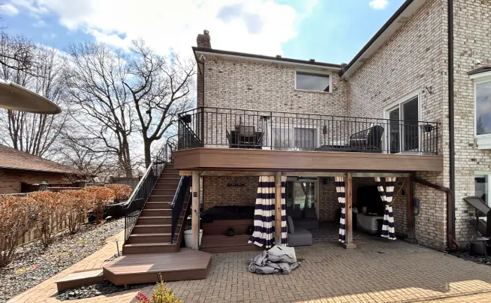 Composite deck builder installing low maintenance composite decking